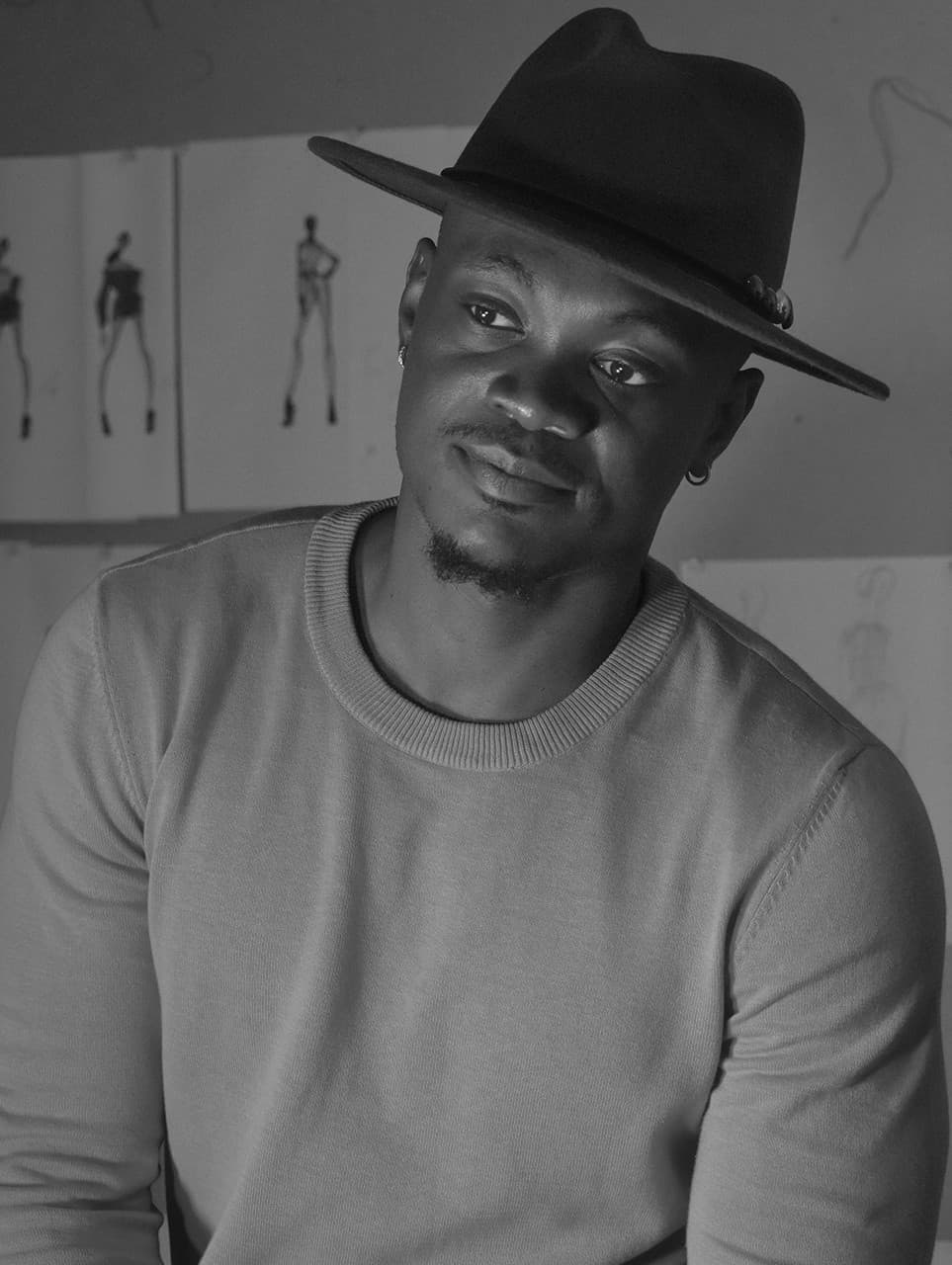 Portrait of designer Chuks Collins wearing a wide-brim hat
