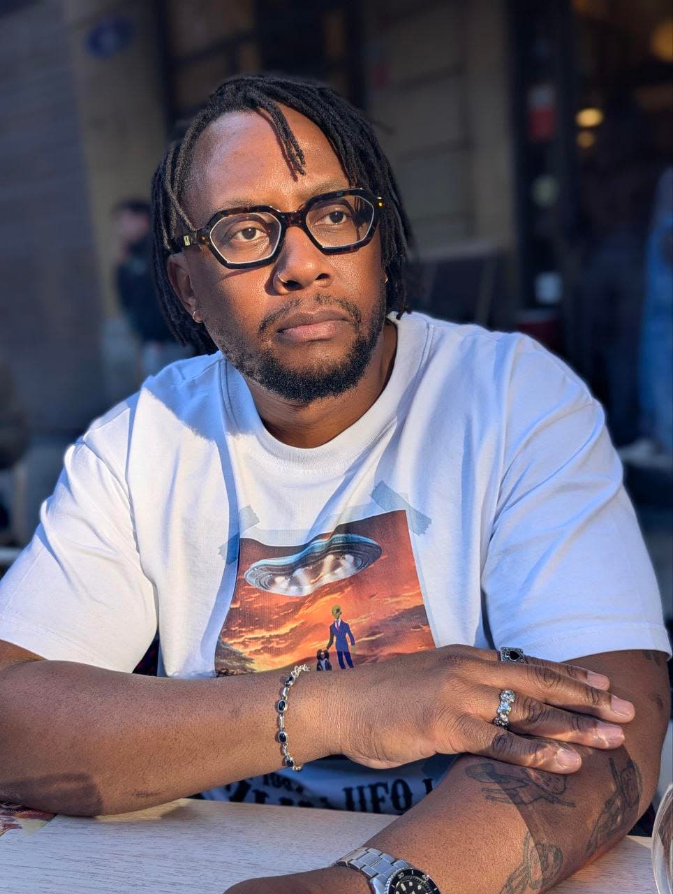 Portrait of The Rad Black Kids founder sitting outdoors